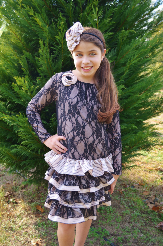Madison is wearing our Almond Truffle dress, style 8376BK, which is available in sizes 2T-14.