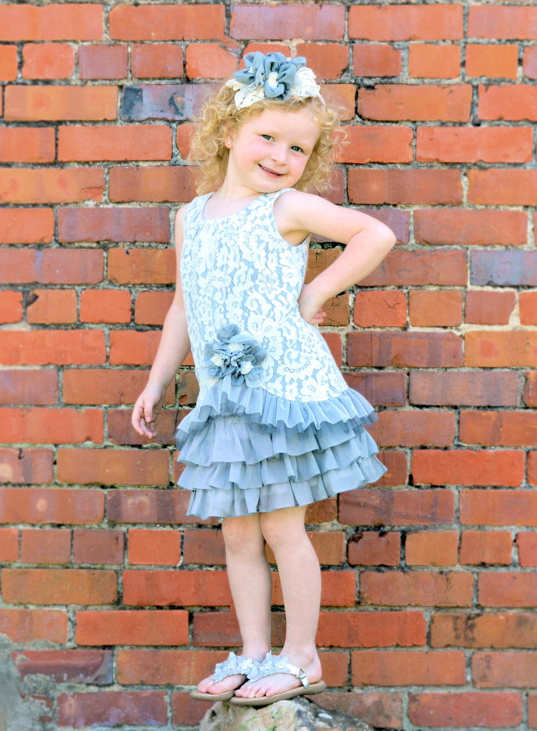 AnnaLane is wearing Countryside Doll, available in stores now in sizes 2T-16.