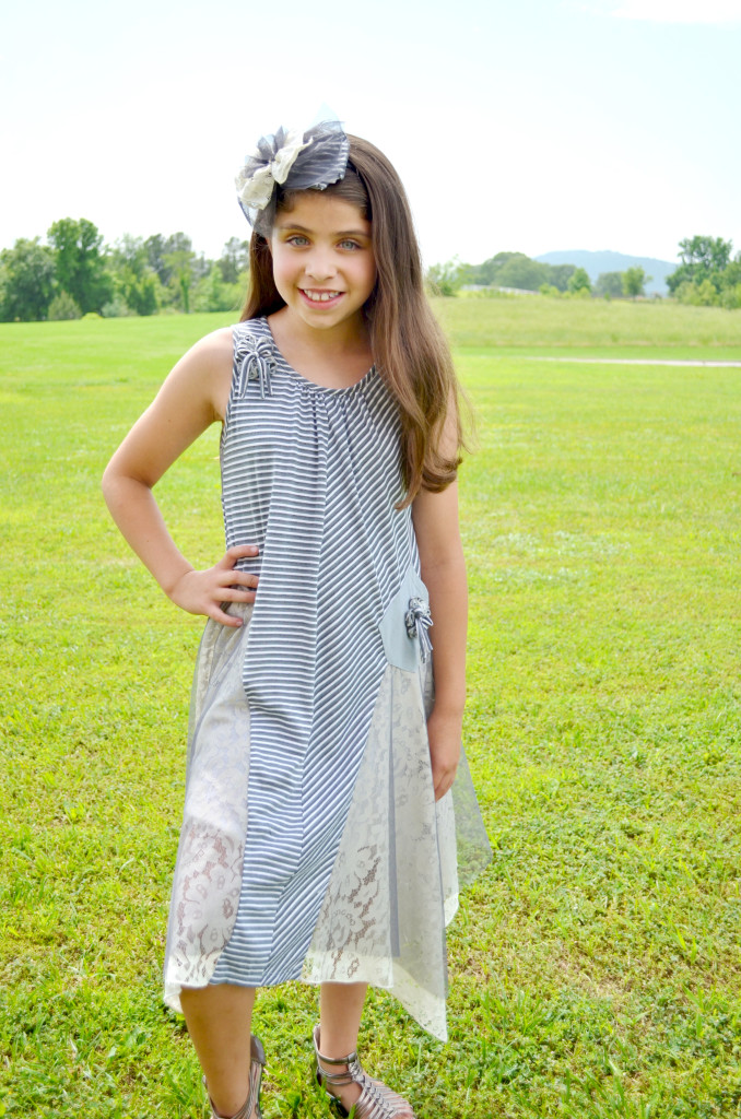 Madison is wearing Isobella & Chloe Park Ave dress, available from size 4-16.