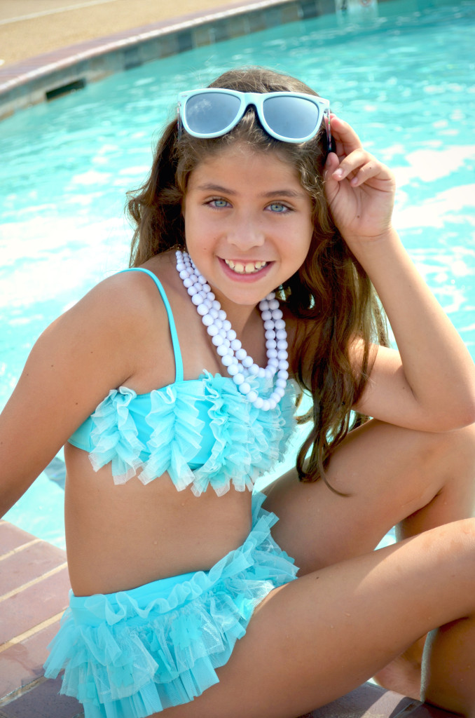 Madison is wearing Makin' A Splash bikini, style 8684TY in size 2T-14, available in stores now.