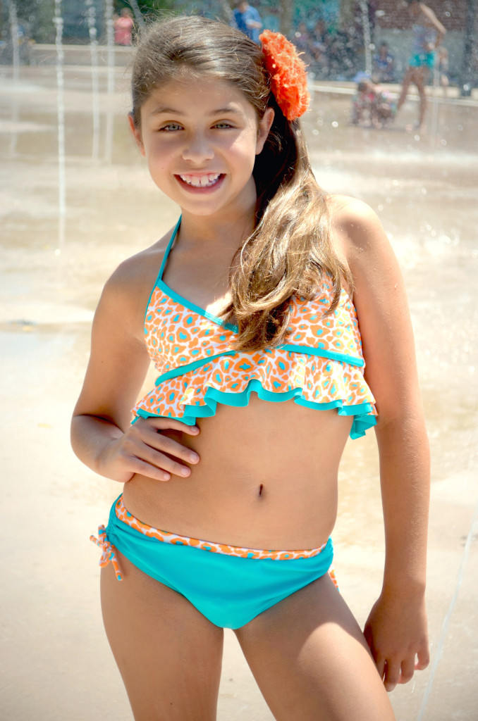 Madison is wearing style Sun, Sand, & Surf, style 8704TL, available in sizes 4-14.